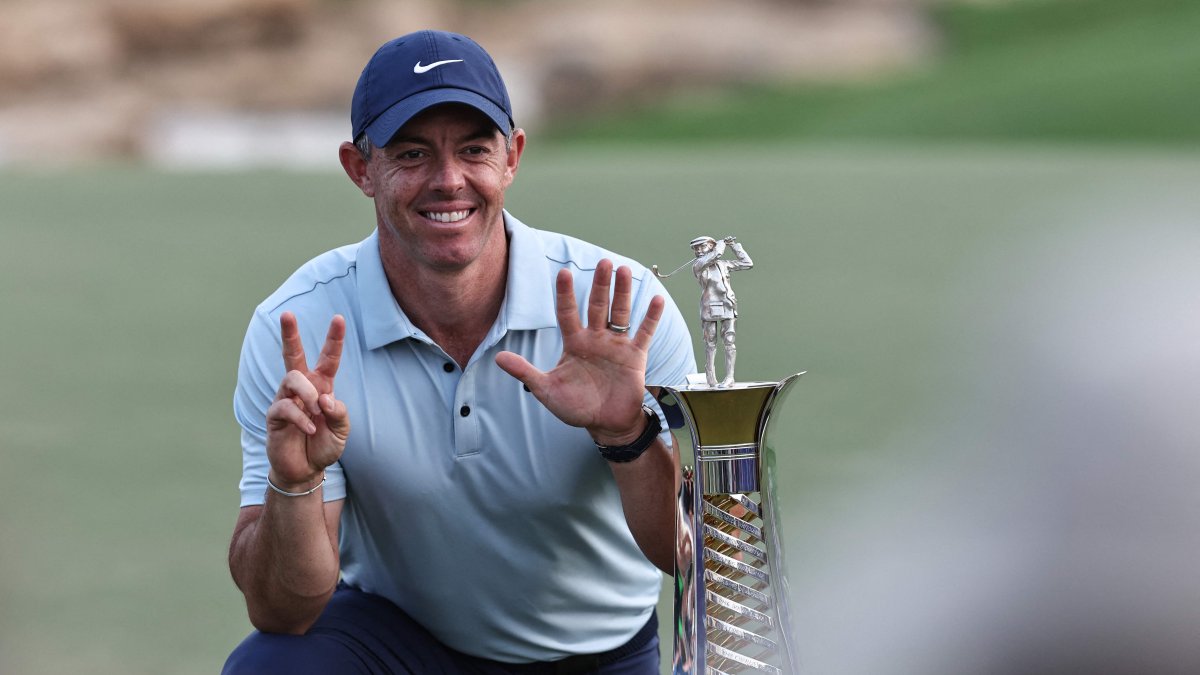 Northern Ireland's Rory McIlroy celebrates with his trophy at the end the 2025 DP World Tour Championship at Jumeirah Golf Estates, Dubai, UAE, Nov. 16, 2025. (AFP Photo)