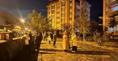 Residents gather outdoors following a 4.6 magnitude earthquake centered in the Tuşba district, Van, Türkiye, Dec. 7, 2025. (AA Photo)
