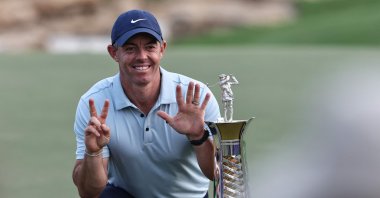 Northern Ireland's Rory McIlroy celebrates with his trophy at the end the 2025 DP World Tour Championship at Jumeirah Golf Estates, Dubai, UAE, Nov. 16, 2025. (AFP Photo)