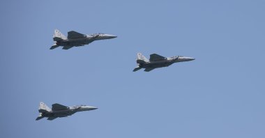 Israeli Air Force F-15 planes fly in formation over the Mediterranean Sea as seen from a Tel Aviv beach, Tel Aviv, Israel, April 15, 2021. (Reuters Photo)