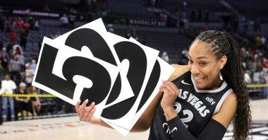 Las Vegas Aces center A'ja Wilson holds up numbers to commemorate her WNBA career 5,000 points after the Aces defeated the Connecticut Sun in a WNBA basketball game, Las Vegas, U.S., June 25, 2025. (AP Photo)
