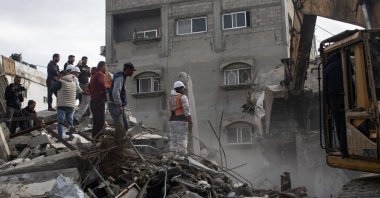 Members of the Palestinian Civil Defense remove the rubble of a destroyed home as they search for the bodies of Palestinians killed during the conflict in Khan Younis, southern Gaza Strip, Dec. 20, 2025. (EPA File Photo)
