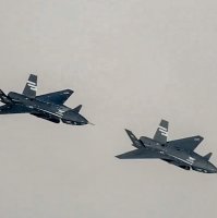 Two Bayraktar Kızılelma jets are seen airborne during close formation flight, Türkiye, Dec. 28, 2025. (AA Photo)