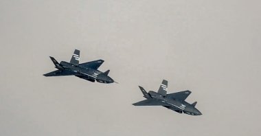 Two Bayraktar Kızılelma jets are seen airborne during close formation flight, Türkiye, Dec. 28, 2025. (AA Photo)