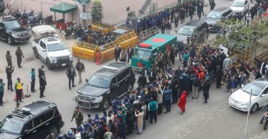 Security personnel escort a convoy carrying Bangladesh's former Prime Minister Khaleda Zia's body in Dhaka, Bangladesh, Dec. 31, 2025. (AFP Photo)