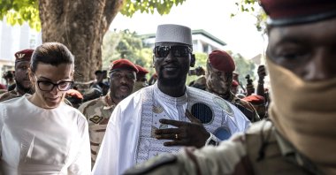Guinea President and presidential candidate Mamady Doumbouya (C) and his wife Lauriane Doumbouya arrive to vote at a polling station in Conakry, Guinea, Dec. 28, 2025. (AFP Photo)