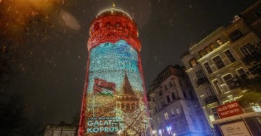 A video mapping display highlighting the humanitarian crisis in Gaza is projected onto the historic Galata Tower, Istanbul, Türkiye, Dec. 30, 2025. (AA Photo)