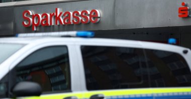 Police park their vehicle in front of a branch of Sparkasse bank in Gelsenkirchen, Germany, Dec. 31, 2025. (Reuters Photo)