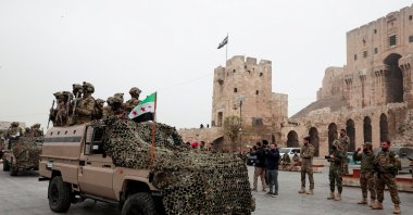 Syrian army members take part in a military parade, as they mark the first anniversary of Bashar Assad&amp;amp;#039;s fall, in Aleppo, Syria, Dec. 8, 2025. (Reuters Photo)