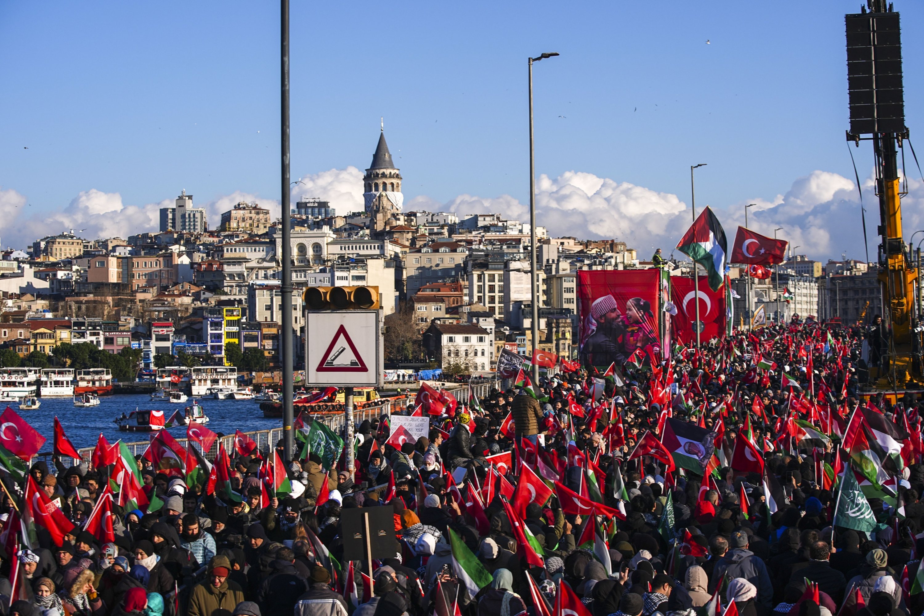 A view of the demonstrators against the backdrop of Galata Tower, in Istanbul, Türkiye, Jan. 1, 2026. (AA Photo) 