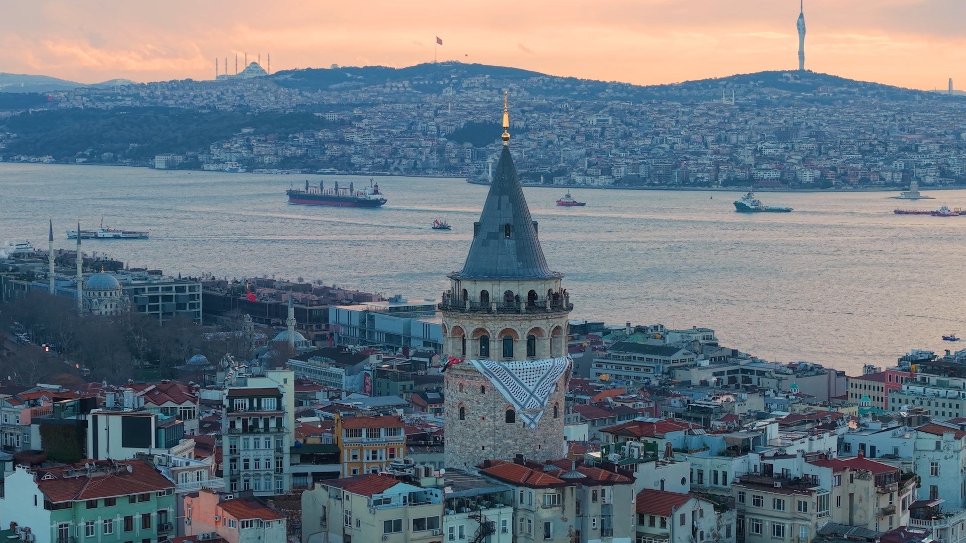 A view of the Galata Tower where a Palestinian keffiyeh is hanged ahead of the rally, in Istanbul, Türkiye, Jan. 1, 2026. (DHA Photo) 