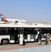 Passengers step out of a bus at Aden Airport in Aden, Yemen, Jan. 1, 2026. (Reuters Photo)
