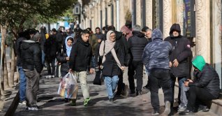 People walk past stores as the value of the Iranian Rial drops, in Tehran, Iran, Dec. 30, 2025. (Reuters Photo)