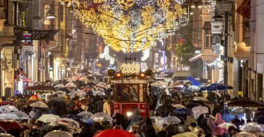 A tram runs along the main shopping and pedestrian street of Istiklal, decorated with New Year's lighting, Istanbul, Türkiye, Dec. 30, 2025. (Reuters Photo)