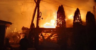 Flames and smoke rise from a fire following what Russian-installed authorities described as an overnight Ukrainian drone strike on a hotel and cafe, amid the ongoing Russia-Ukraine conflict in the village of Khorly, in the Kherson Region, a Russian-controlled area of Ukraine, Jan. 1, 2026. (Reuters Photo)
