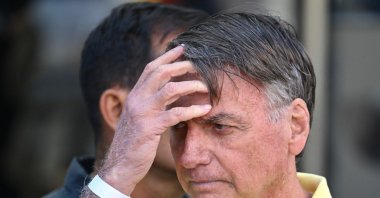 Former Brazilian President Jair Bolsonaro gestures after taking medical tests at DF Star hospital, Brasilia, Brazil, Aug. 16, 2025. (AFP Photo)