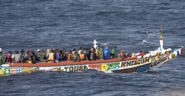 Migrants crowd a wooden boat as they sail to the port in La Restinga on the Canary island of El Hierro, Spain, Aug. 19, 2024. (AP Photo)