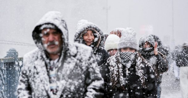 People walking amid heavy snowfall in Istanbul, Türkiye, Jan. 1, 2026. (AA Photo) 