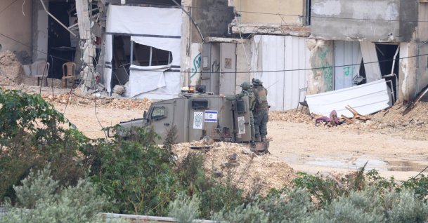 Israeli soldiers watch during a military operation in Nur Shams refugee camp, near the city of Tulkarem, occupied West Bank, Palestine, Jan. 1, 2026. (EPA Photo)