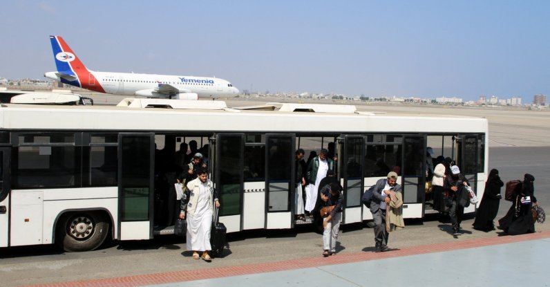 Passengers step out of a bus at Aden Airport in Aden, Yemen, Jan. 1, 2026. (Reuters Photo)