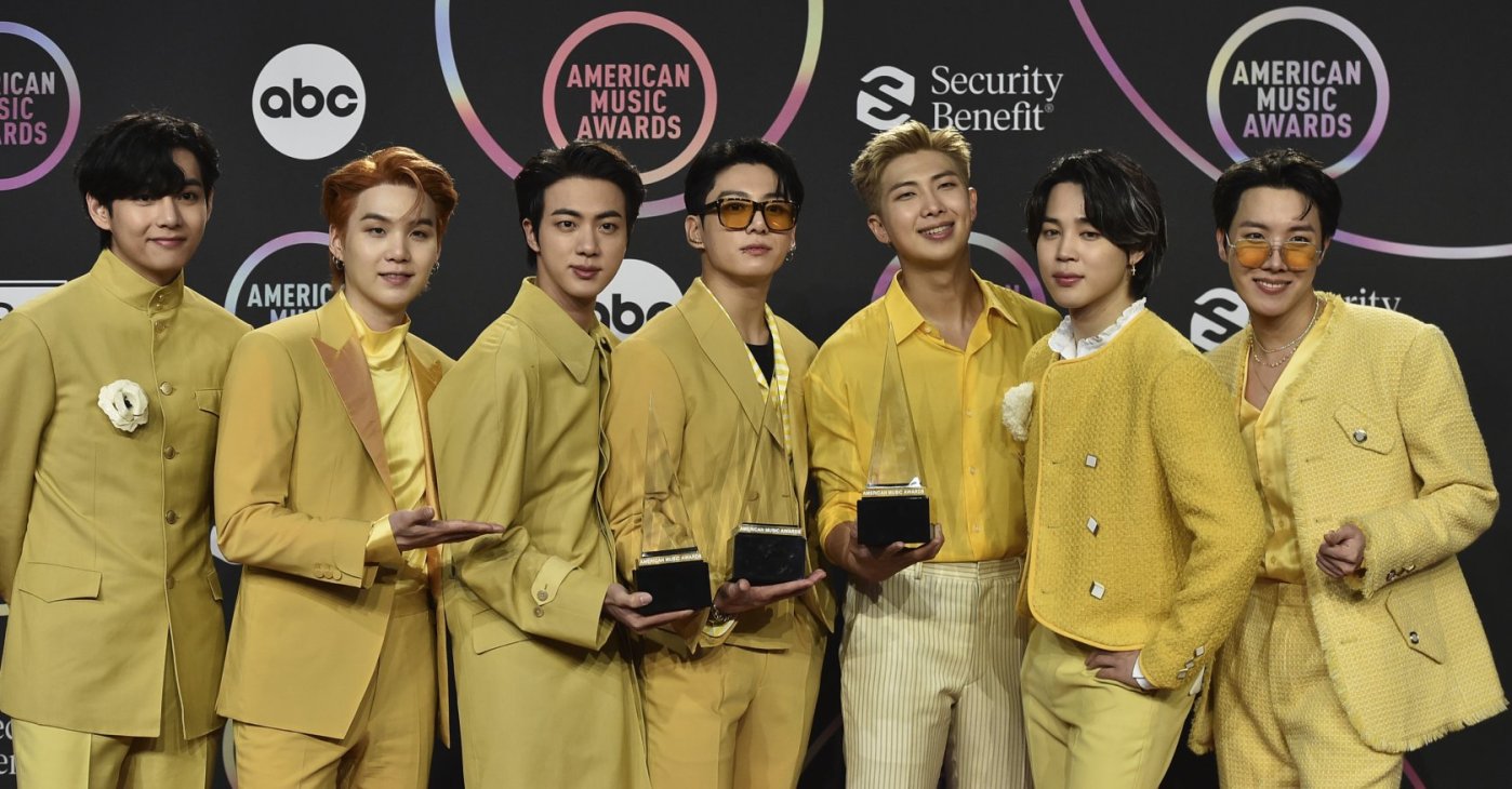 BTS poses in the press room with the awards for favorite pop duo or group, favorite pop song for "Butter," and artist of the year at the American Music Awards at Microsoft Theater in Los Angeles, U.S., Nov. 21, 2021. (AP Photo)