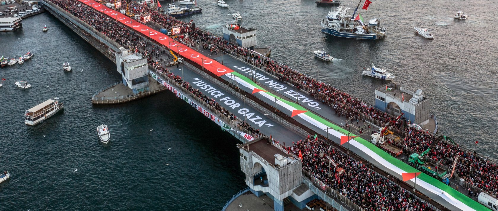 A drone view shows people gathering over the Galata Bridge in solidarity with Palestinians on New Year's Day in Istanbul, Türkiye, January 1, 2026. (Reuters Photo) 