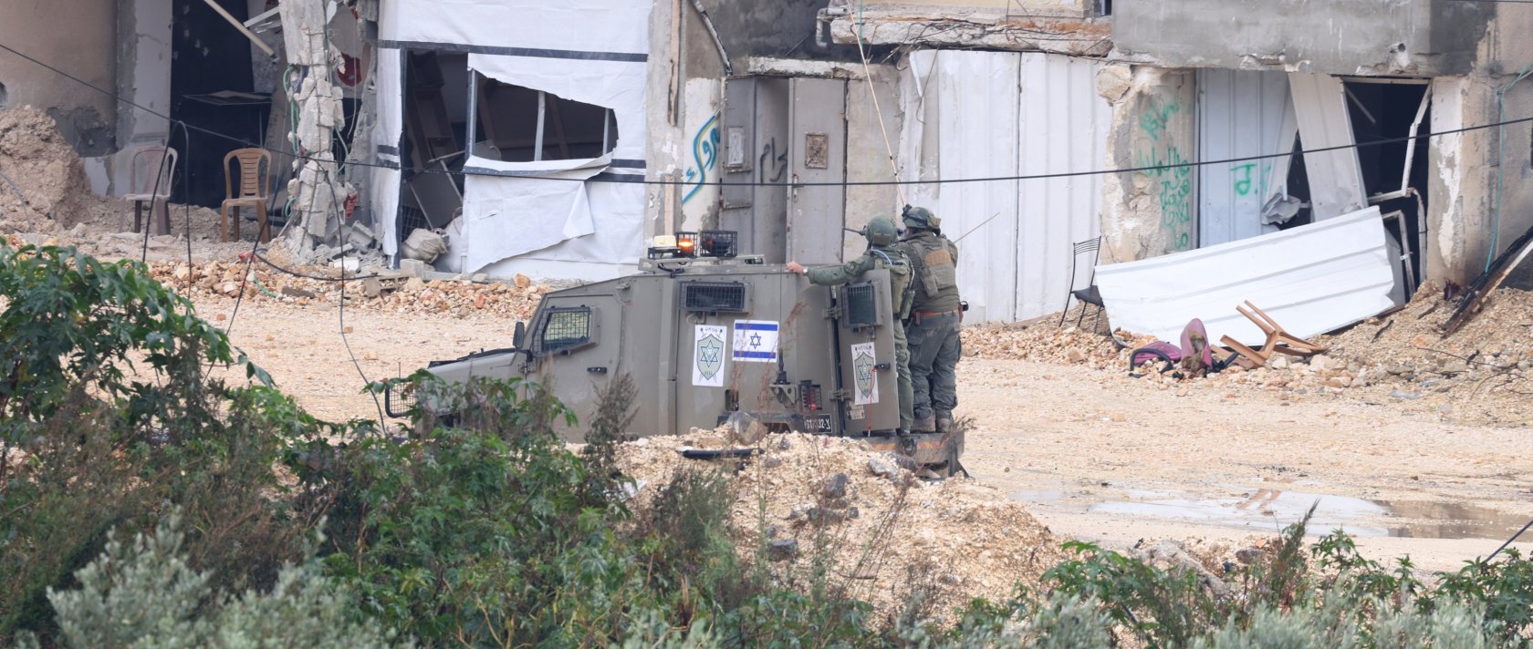 Israeli soldiers watch during a military operation in Nur Shams refugee camp, near the city of Tulkarem, occupied West Bank, Palestine, Jan. 1, 2026. (EPA Photo)