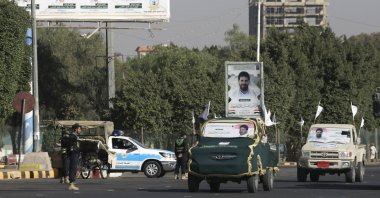 Vehicles carry portraits of a Houthi military commander who was killed in a U.S. airstrike, during a funeral procession in Sana'a, Yemen, Jan. 1, 2026. (EPA Photo)