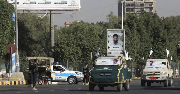Vehicles carry portraits of a Houthi military commander who was killed in a U.S. airstrike, during a funeral procession in Sana'a, Yemen, Jan. 1, 2026. (EPA Photo)