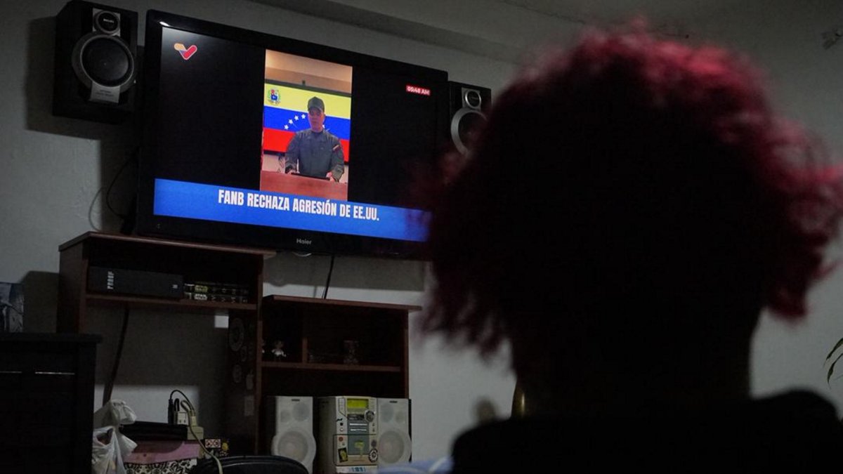 Venezuelans watch as Defense Minister Vladimir Padrino speaks on the television following U.S. attacks that captured President Nicolas Maduro and his wife, in Caracas, Venezuela, Jan. 3, 2026. (AA Photo)