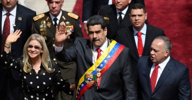 Venezuelan President Nicolas Maduro (C) and First Lady Cilia Flores (L) wave next to the president of the Constituent Assembly Diosdado Cabello, upon their arrival at the Constituent Assembly in Caracas, Venezuela, Jan. 14, 2020. (AFP Photo)