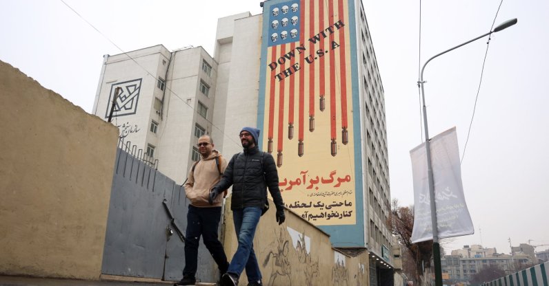 Iranians walk past an anti-US mural on a street in Tehran, Iran, Jan. 3, 2026. (EPA Photo)
