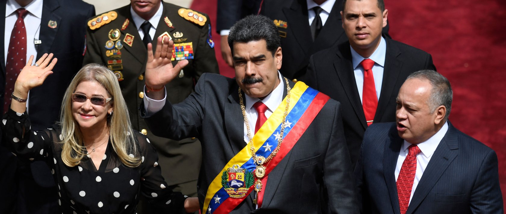 Venezuelan President Nicolas Maduro (C) and First Lady Cilia Flores (L) wave next to the president of the Constituent Assembly Diosdado Cabello, upon their arrival at the Constituent Assembly in Caracas, Venezuela, Jan. 14, 2020. (AFP Photo)