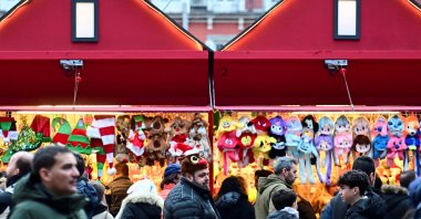 Visitors enjoy the traditional Christmas market at Plaza Mayor during the evening rush in Madrid, Spain, Dec. 14, 2025. (Reuters Photo)