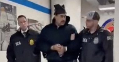 This screengrab taken from the X account of Rapid Response 47, the official White House rapid response account, shows Venezuelan President Nicolas Maduro (C) escorted by DEA agents inside the headquarters of the US Drug Enforcement Administration (DEA) in lower Manhattan, New York, U.S., Jan. 3, 2026. (AAFP Photo)