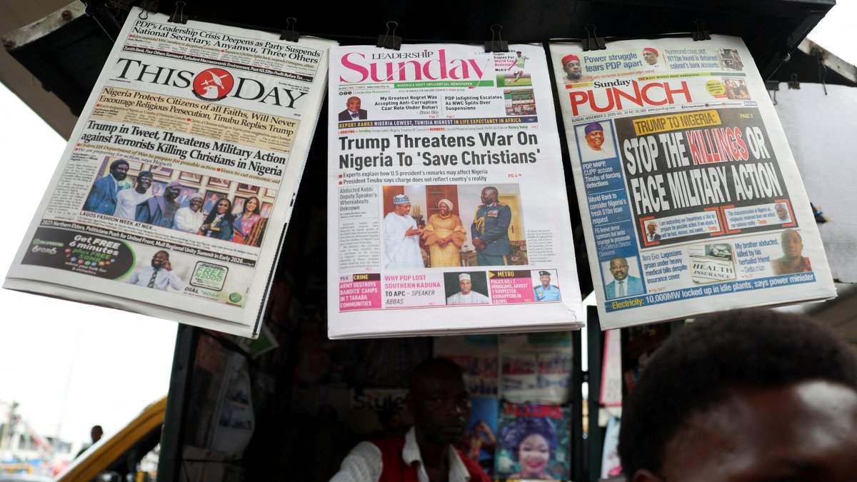 Newspapers with articles reporting U.S. President Donald Trump's message to Nigeria over the treatment of Christians at a newspaper stand, Ojuelegba, Lagos, Nigeria, Nov. 2, 2025. (Reuters File Photo)