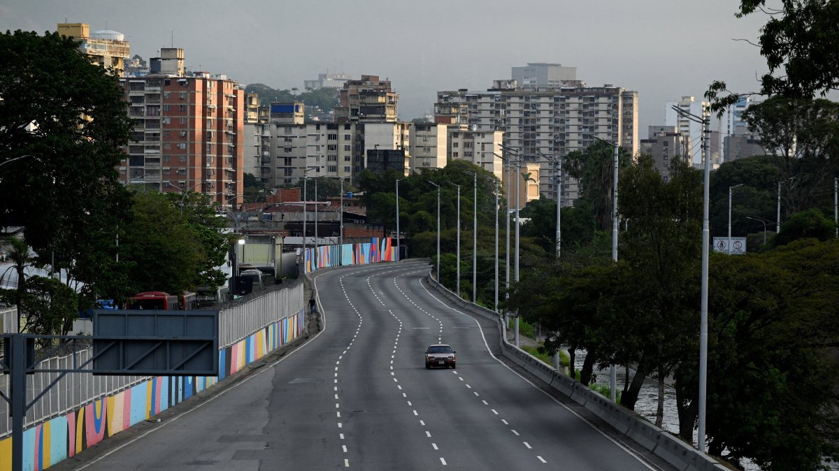 A car drives on an empty street, after U.S. President Donald Trump said the U.S. struck Venezuela and captured its President Nicolas Maduro, Caracas, Venezuela, Jan. 3, 2026. (Reuters Photo)