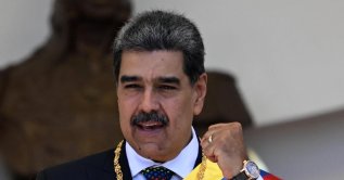 Former Venezuelan President Nicolas Maduro gestures as he leaves the Capitolio - home of the National Assembly - after taking the oath during the presidential inauguration, Caracas, Venezuela, Jan. 10, 2025. (AFP Photo)