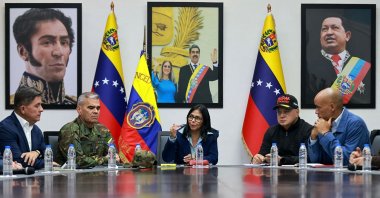 This handout picture released by the Miraflores Palace press office shows Venezuela's Vice-President Delcy Rodriguez (C) speaking next to Venezuelan Defense Minister Vladimir Padrino Lopez (2nd-L) and Venezuela's Minister of Interior Relations, Justice, and Peace, Diosdado Cabello (2nd-R) during a council of ministers meeting at the Vice Presidency headquarters in Caracas on January 4, 2026. (AFP Photo)