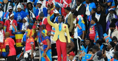 Democratic Republic of Congo's supporter Michel Kuka Mbolandinga pays tribute to Democratic Republic of Congo's late Prime Minister Patrice Lumumba by remaining motionless during the Africa Cup of Nations (AFCON) Group D football match between Botswana and Democratic Republic of Congo at El Madina Stadium, Rabat, Morocco, Dec. 30, 2025. (AA Photo)