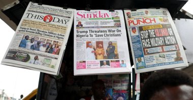Newspapers with articles reporting U.S. President Donald Trump's message to Nigeria over the treatment of Christians at a newspaper stand, Ojuelegba, Lagos, Nigeria, Nov. 2, 2025. (Reuters File Photo)