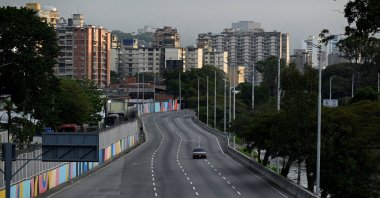 A car drives on an empty street, after U.S. President Donald Trump said the U.S. struck Venezuela and captured its President Nicolas Maduro, Caracas, Venezuela, Jan. 3, 2026. (Reuters Photo)