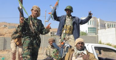 Government soldiers ride on the back of a pick-up truck in the Arabian Sea port city of Mukalla, capital of Hadramout province, Yemen, Jan. 4, 2026. (Reuters Photo)