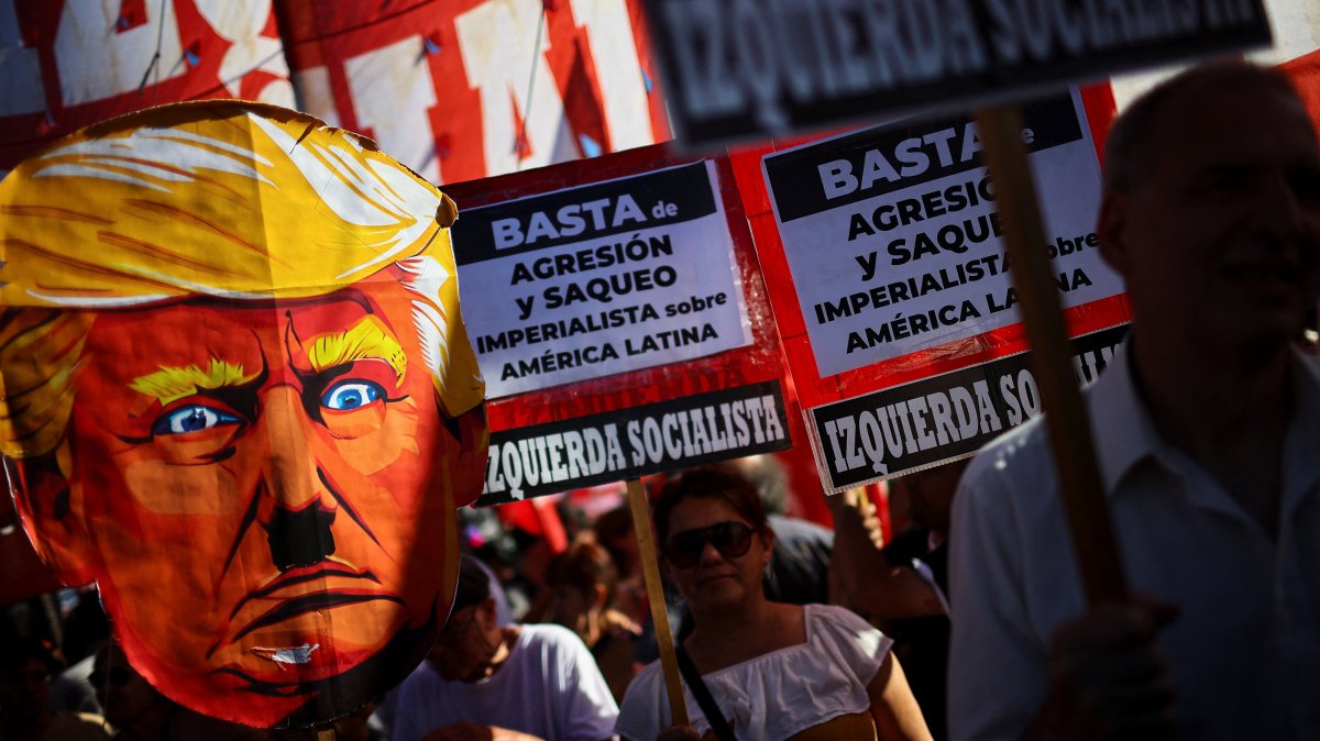 A demonstrator holds a cardboard depiction of U.S. President Donald Trump outside the U.S. Embassy during a protest following the U.S. attack on Venezuela, Buenos Aires, Argentina, Jan. 5, 2026. (Reuters Photo)