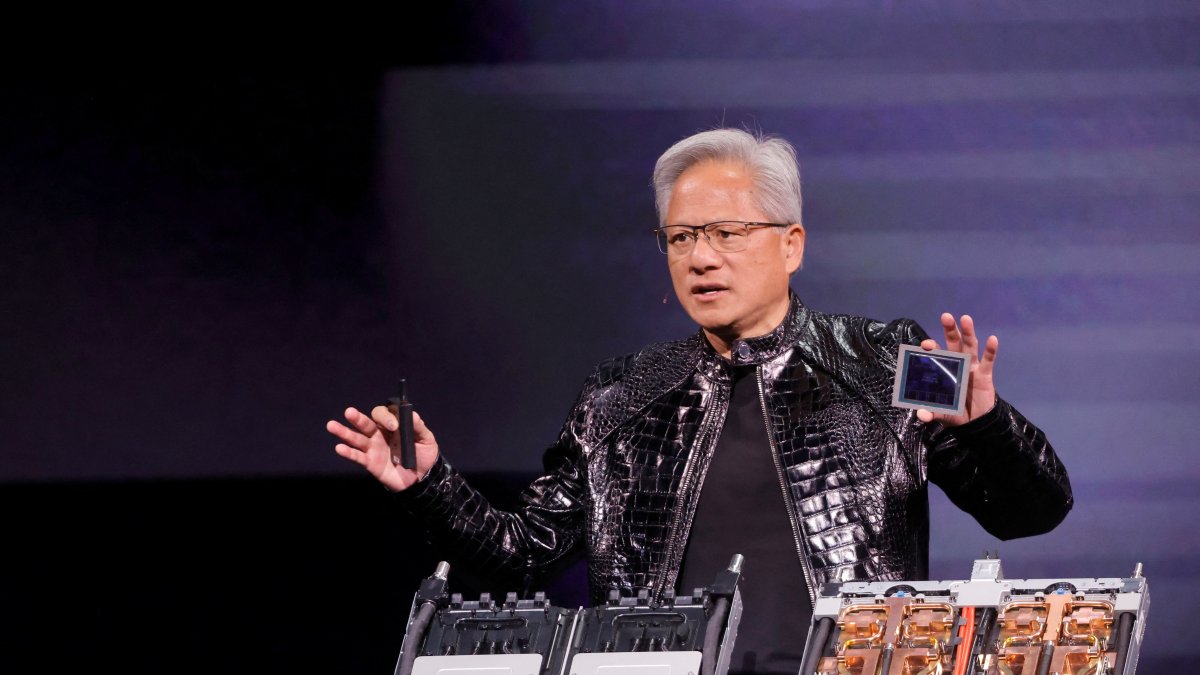 Nvidia CEO Jensen Huang holds a Rubin GPU during a Nvidia keynote address at CES 2026, Las Vegas, Nevada, U.S. Jan. 5, 2026.  (Reuters Photo)