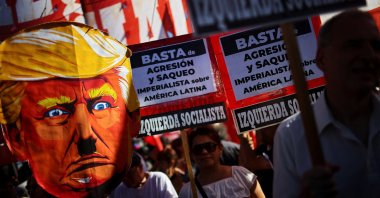 A demonstrator holds a cardboard depiction of U.S. President Donald Trump outside the U.S. Embassy during a protest following the U.S. attack on Venezuela, Buenos Aires, Argentina, Jan. 5, 2026. (Reuters Photo)