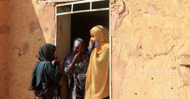 Three displaced women from North Kordofan State take shelter in Omdurman, Khartoum, Nov. 10, 2025. (AFP Photo)