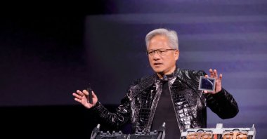 Nvidia CEO Jensen Huang holds a Rubin GPU during a Nvidia keynote address at CES 2026, Las Vegas, Nevada, U.S. Jan. 5, 2026.  (Reuters Photo)