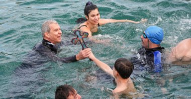 Orthodox Christians perform a traditional cross-diving ceremony at Moda Pier in Kadıköy, Istanbul, Türkiye, Jan. 6, 2025. (AA Photo)