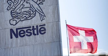 A Swiss flag flutters on the headquarters of Nestlé, Vevey, Switzerland, Nov. 25, 2024. (Reuters Photo)